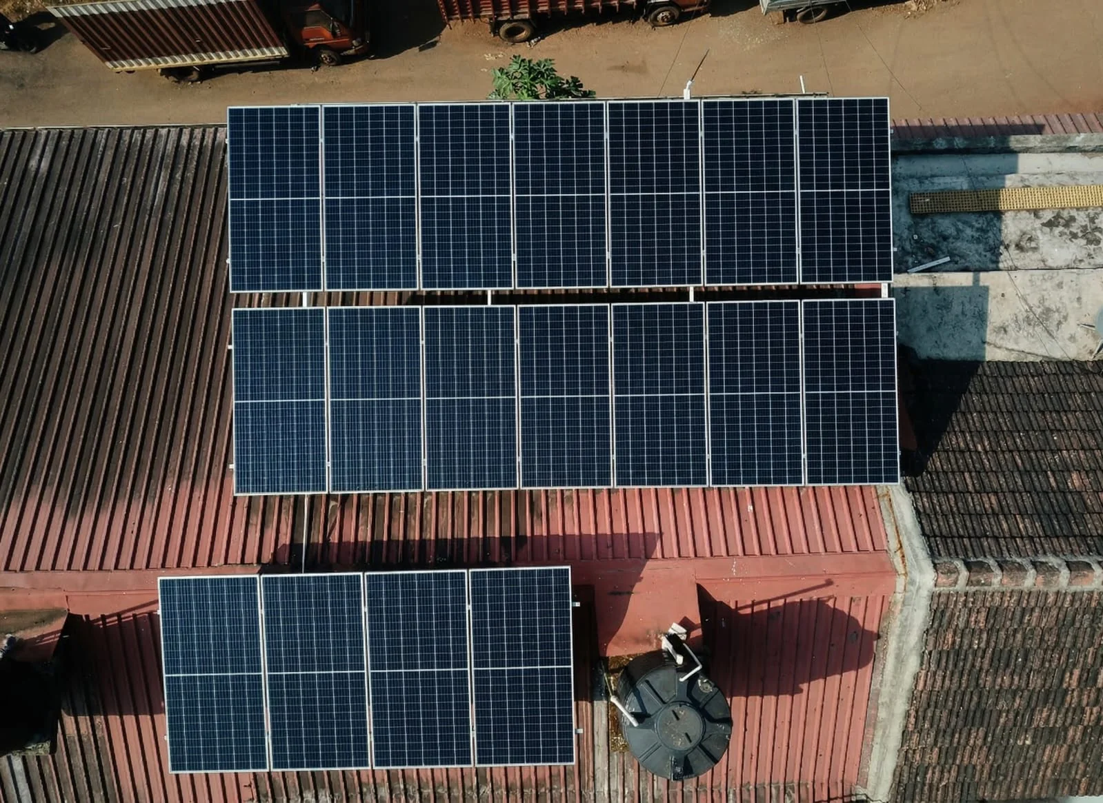 Three solar arrays on a broad red roof